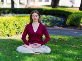 a meditator sitting along in the park